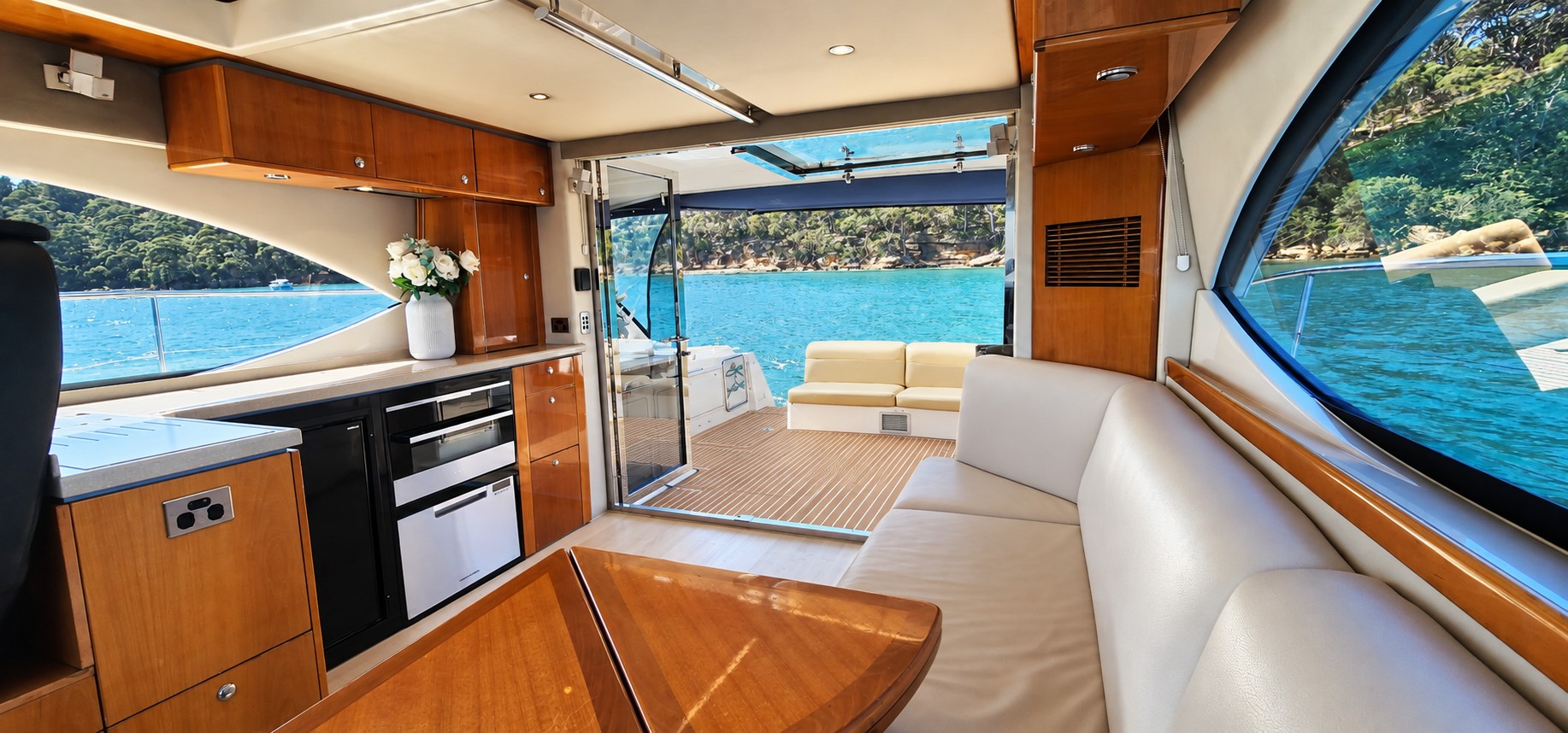 SEADUCTION’s open saloon and aft deck with warm synthetic teak